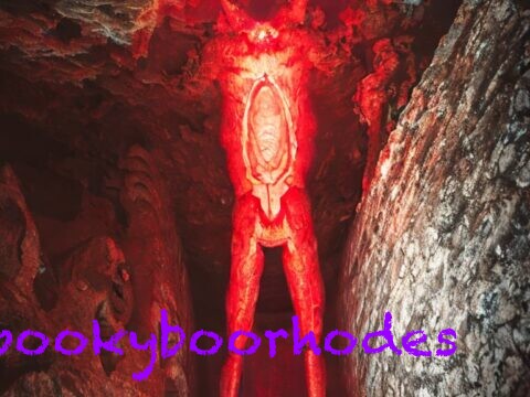 creepy red demon in a cave